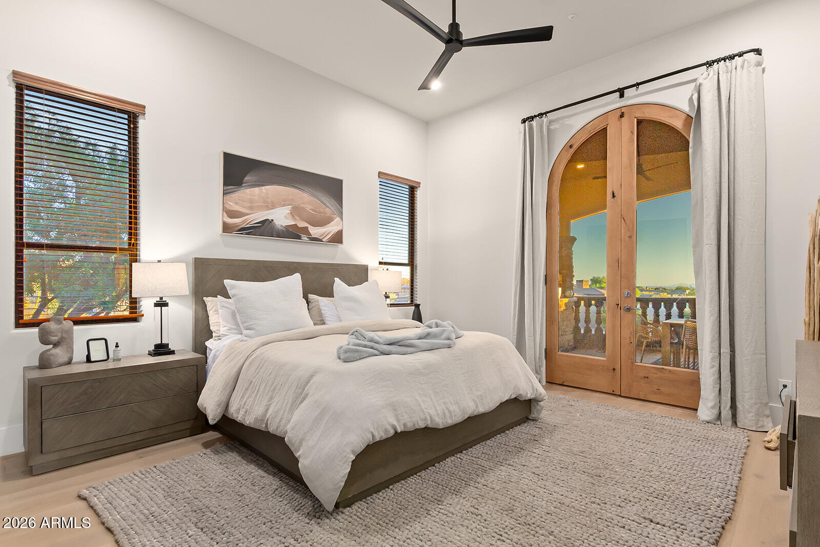 11861 East Desert Trail Road Scottsdale, AZ 85259 - Photo 33 of 63 a bedroom with a large bed and a window