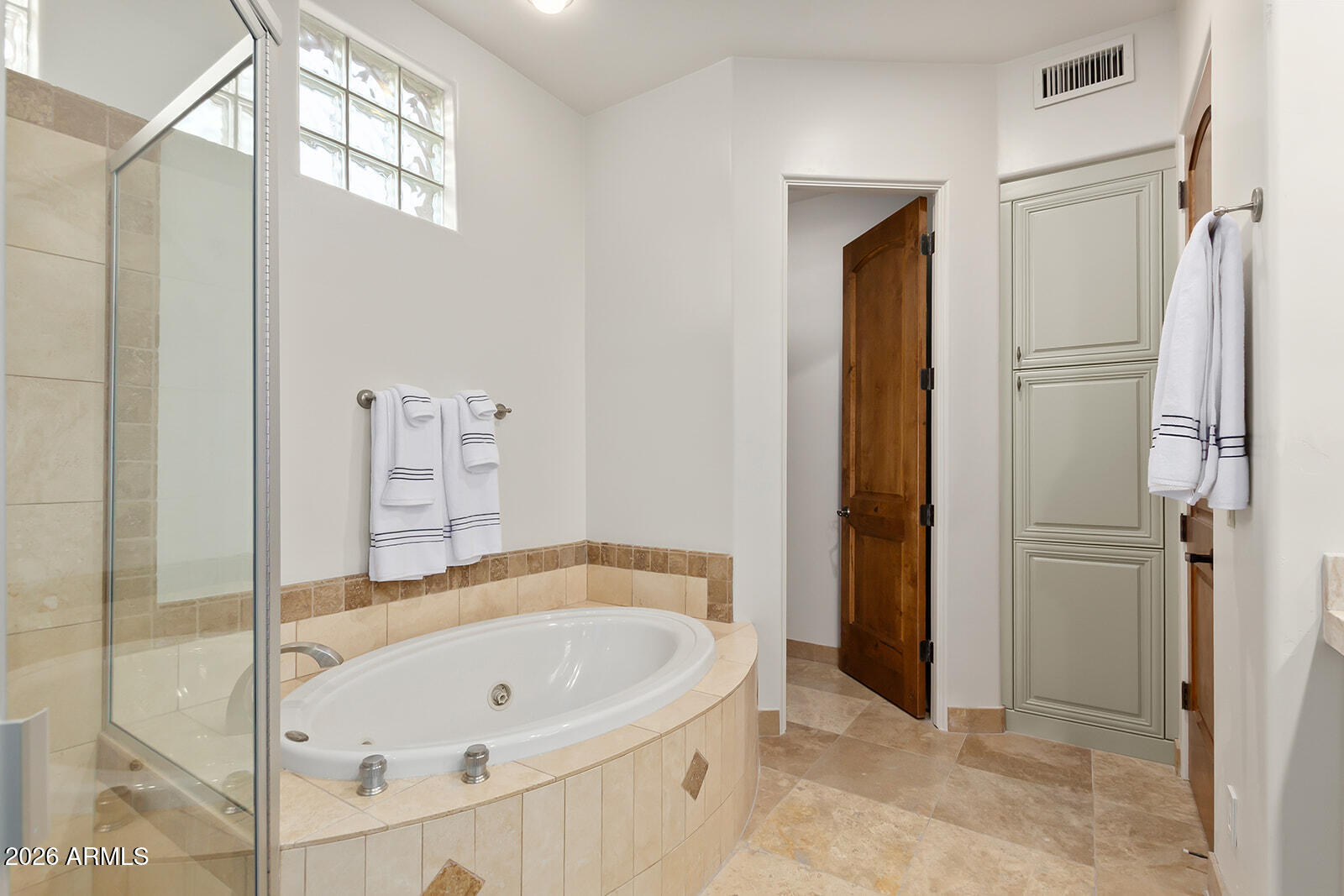 11861 East Desert Trail Road Scottsdale, AZ 85259 - Photo 42 of 63 a bathroom with a tub and shower