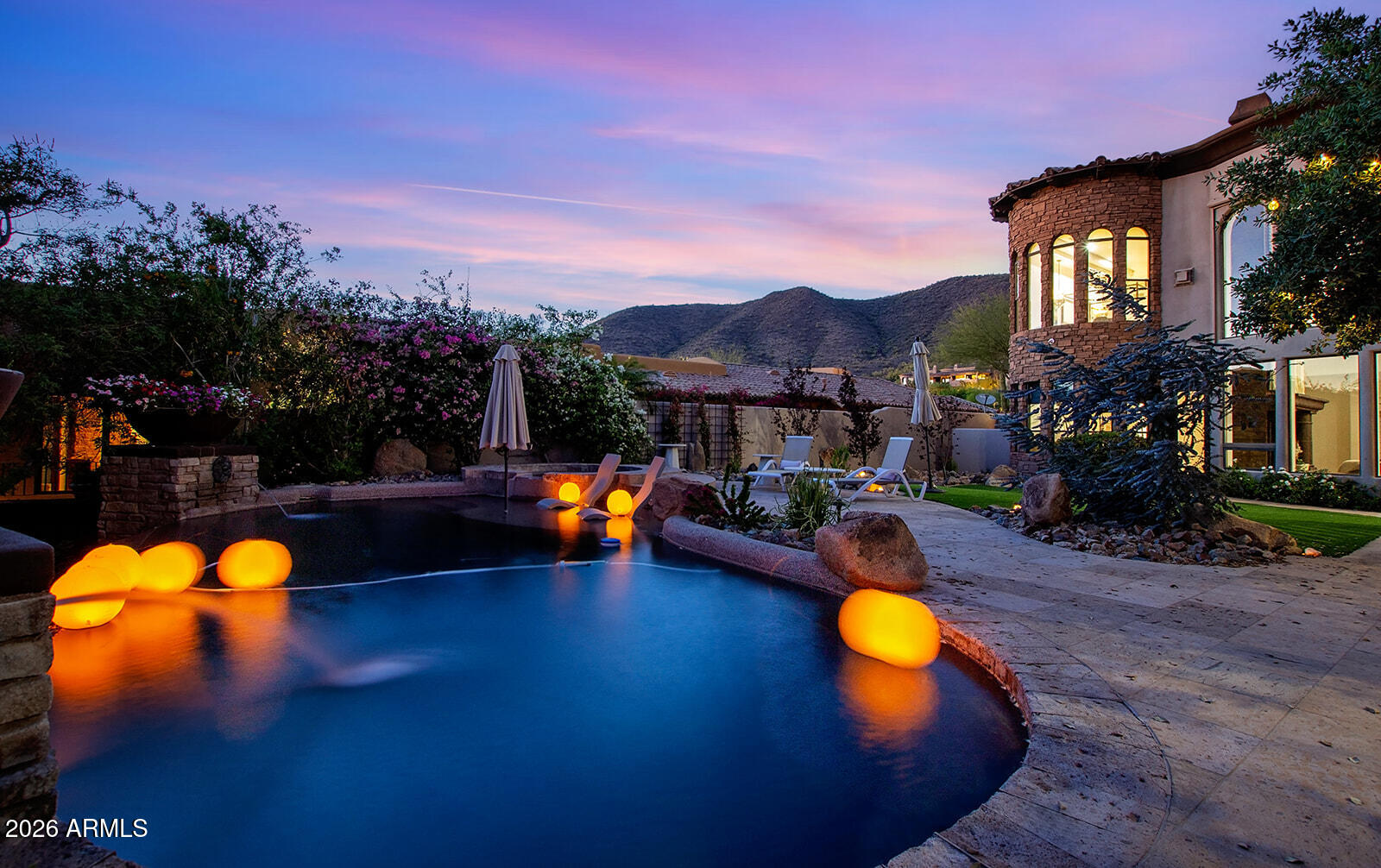 11861 East Desert Trail Road Scottsdale, AZ 85259 - Photo 57 of 63 a view of a swimming pool with a table and chairs