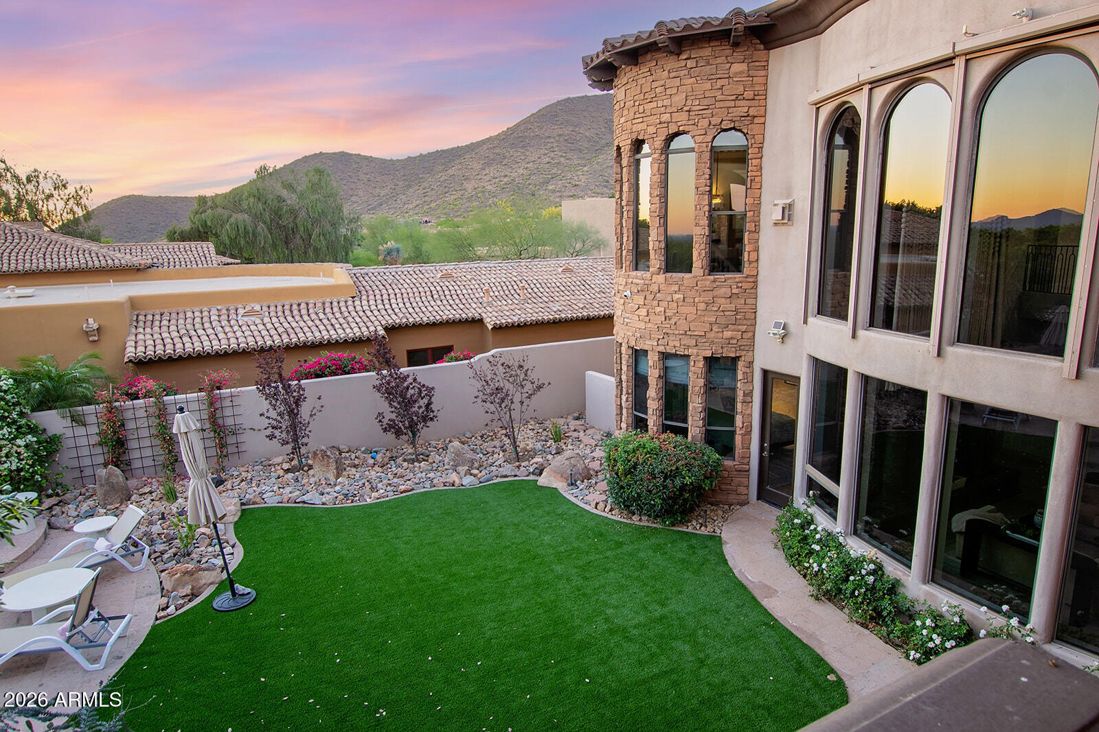 11861 East Desert Trail Road Scottsdale, AZ 85259 - Photo 58 of 63 a view of a brick house with a large windows