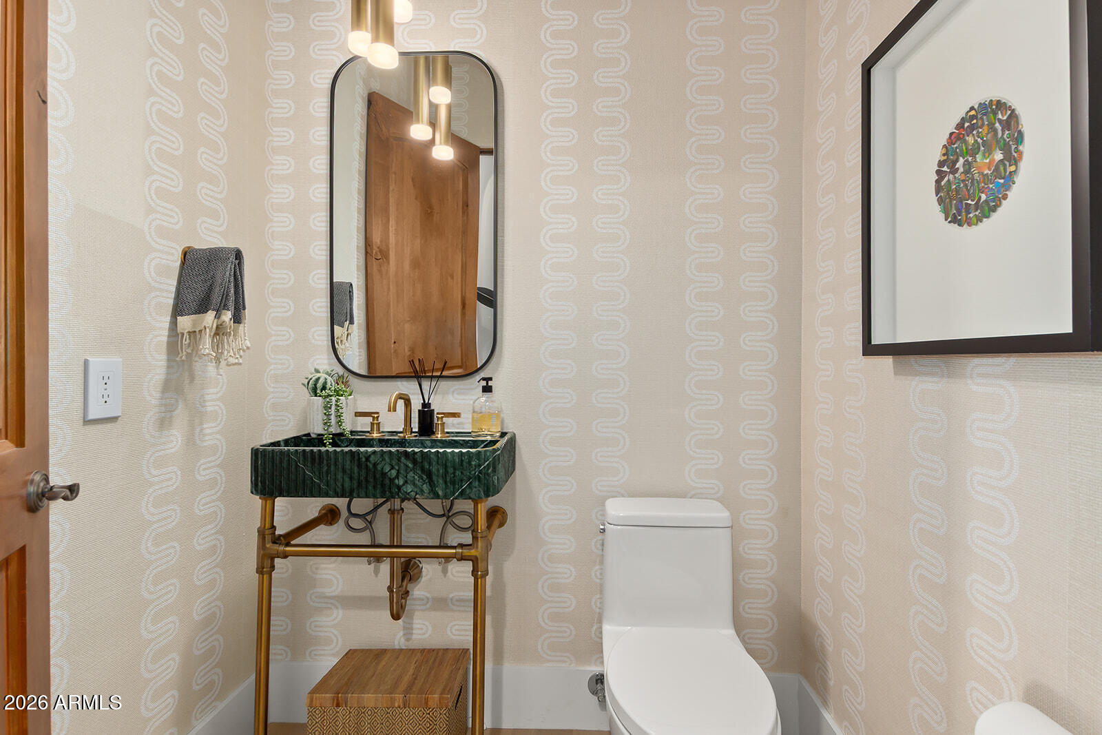 11861 East Desert Trail Road Scottsdale, AZ 85259 - Photo 59 of 63 a bathroom with a toilet a sink and mirror