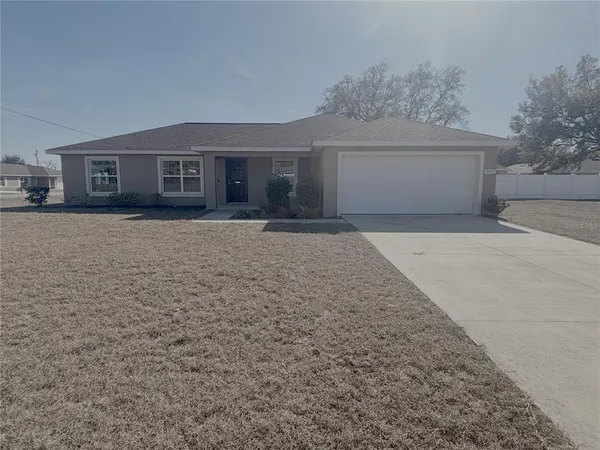 a front view of a house with yard