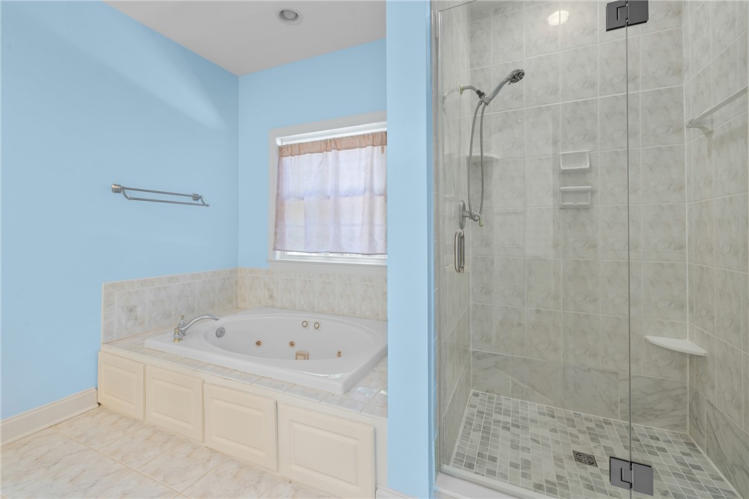 110 Brookstone Way Central, SC 29630 - Photo 25 of 46 Relax and refresh in this tranquil bathroom, offering a rejuvenating soaking tub and a spacious shower.