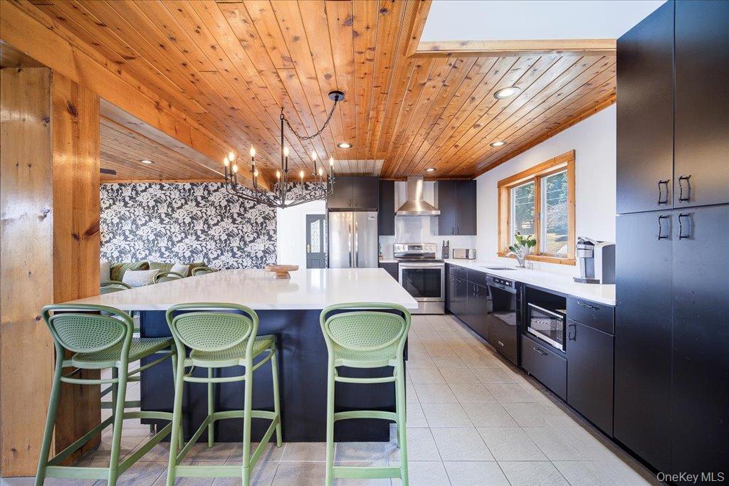 363 Hurd Road, Unit TR48 Bethel, NY 12783 - Photo 7 of 43 Kitchen with Island seating