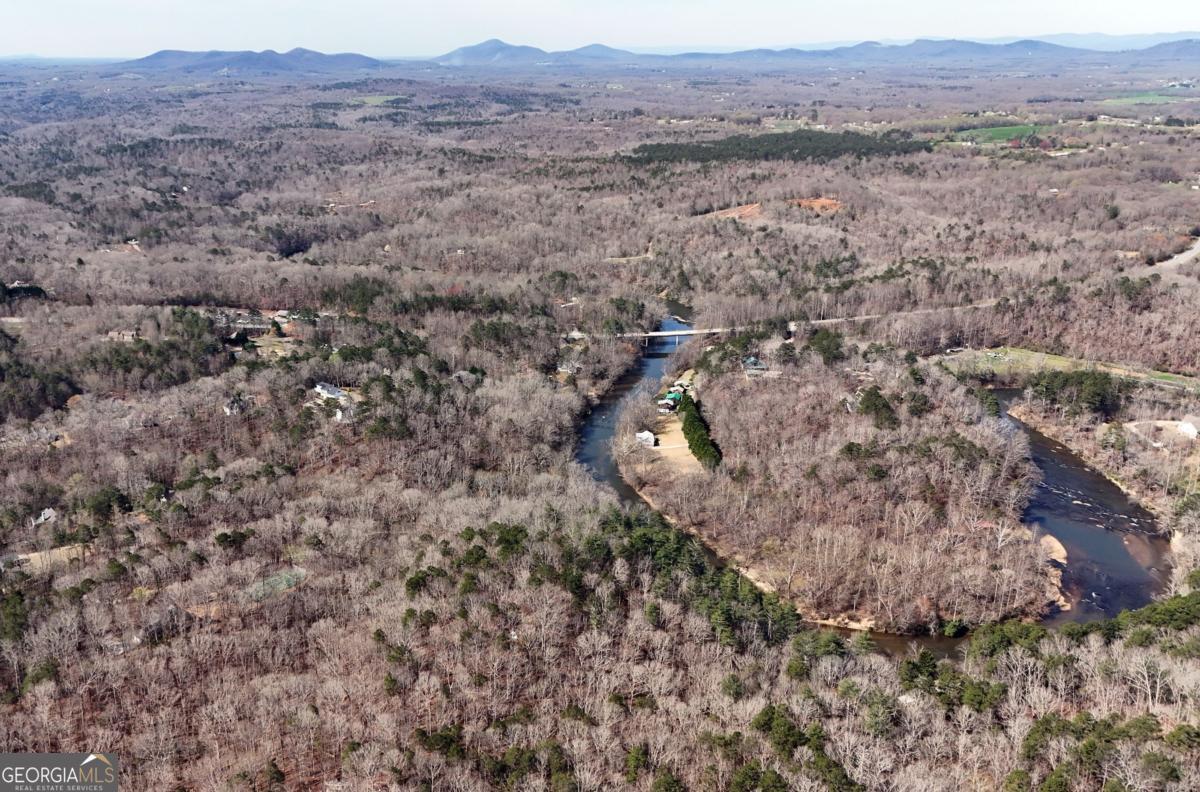 Lot #8 Casa Rio Drive, Unit 8 Cornelia, GA 30531 - Photo 35 of 46 a view of a dry field with trees in the background