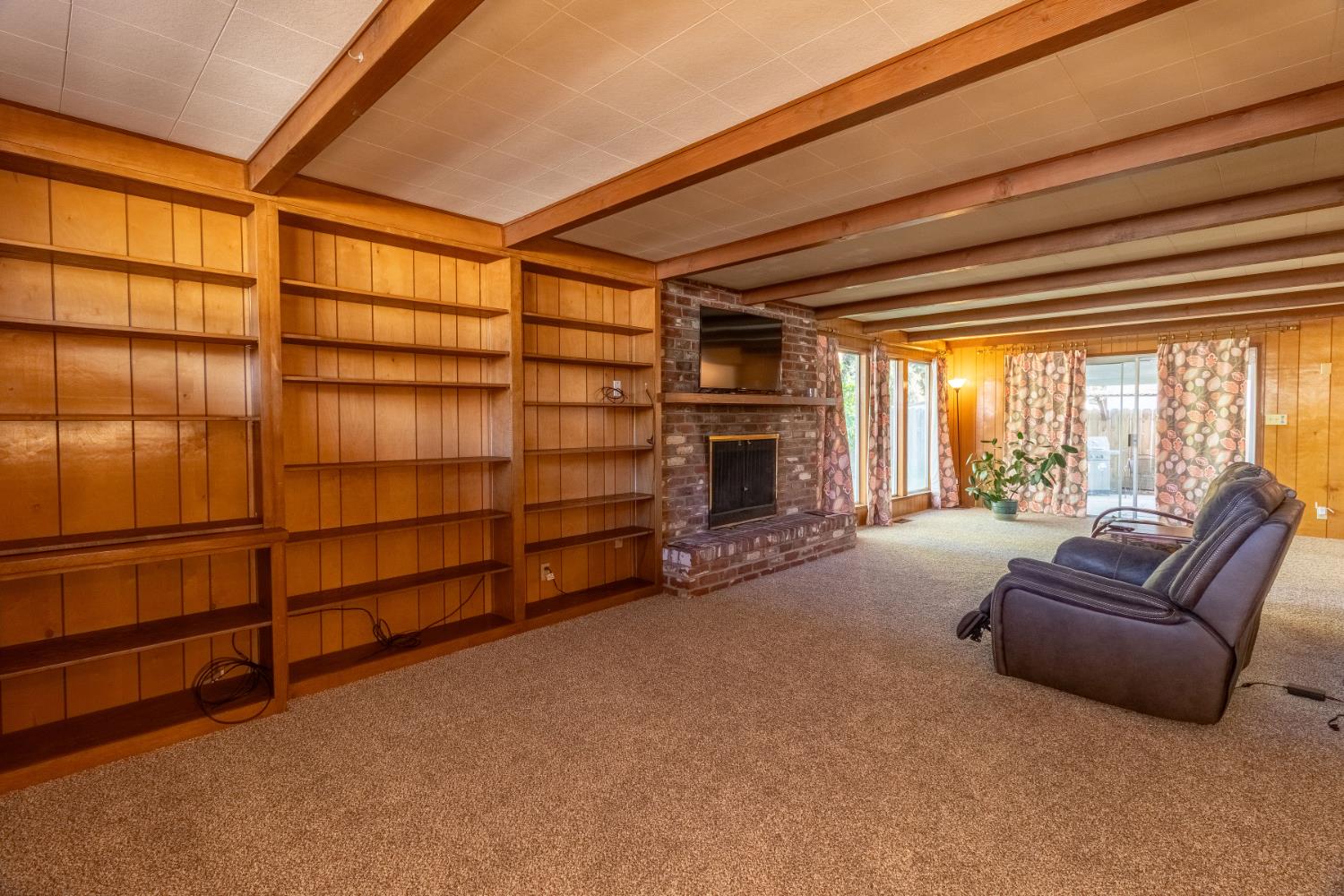 822 South California Street Lodi, CA 95240 - Photo 14 of 34 a living room with furniture and a fireplace