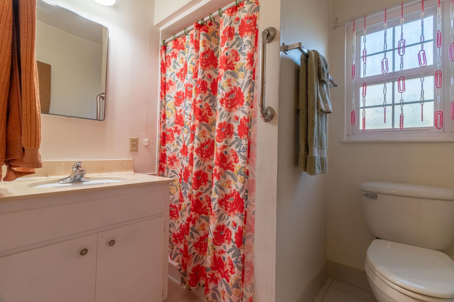 822 South California Street Lodi, CA 95240 - Photo 18 of 34 a bathroom with a granite countertop sink toilet and a mirror