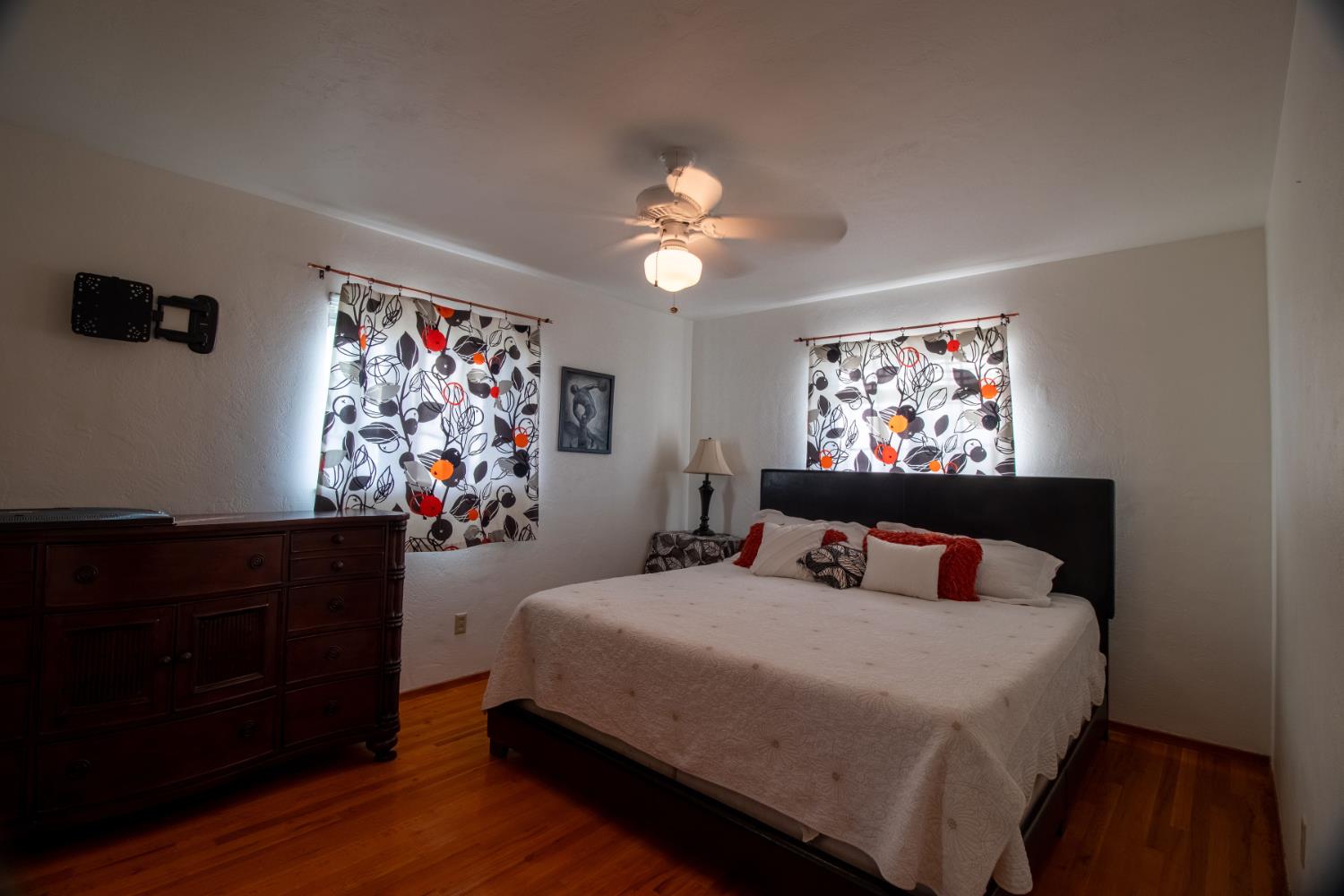 822 South California Street Lodi, CA 95240 - Photo 19 of 34 a bedroom with a bed and wooden floor