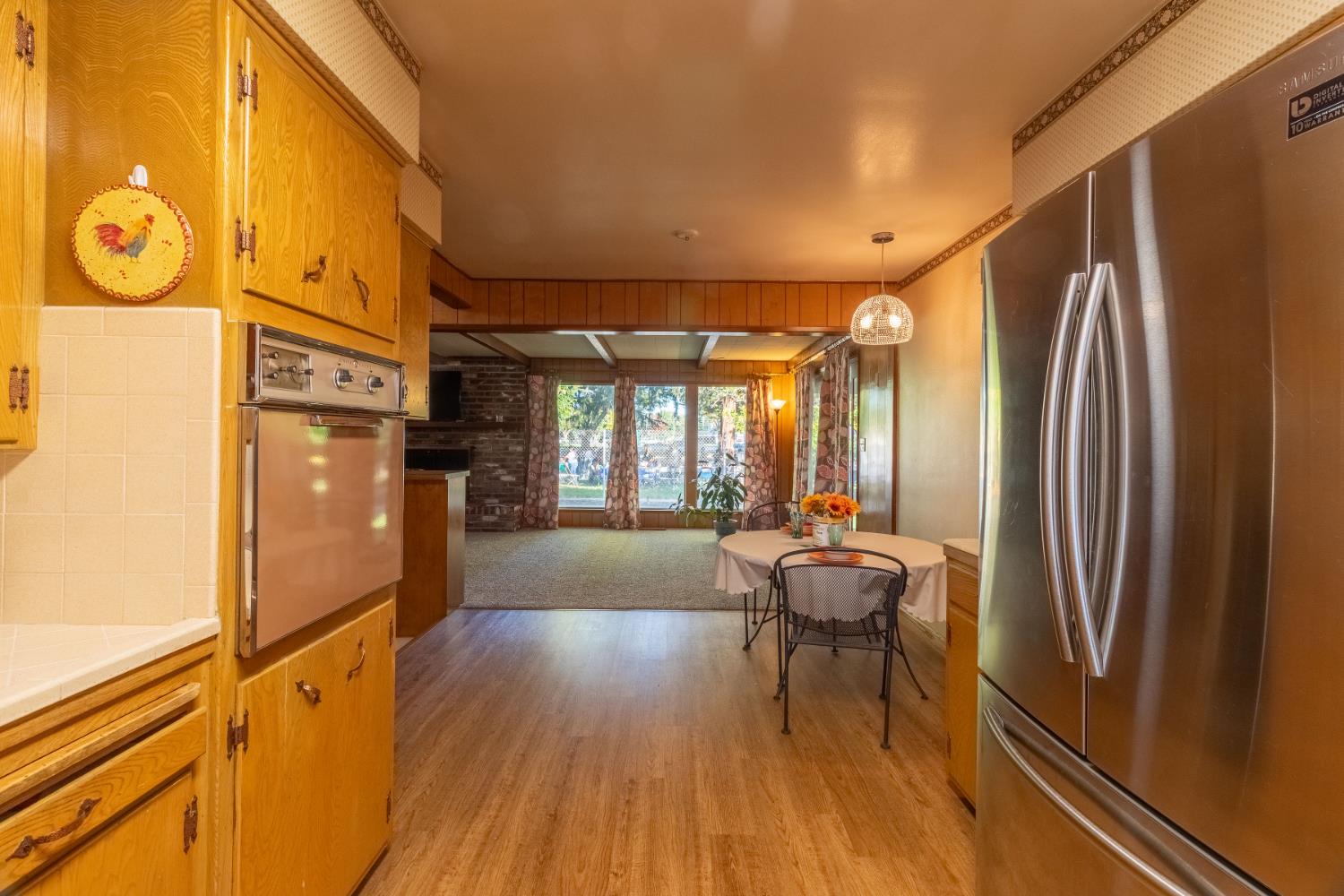 822 South California Street Lodi, CA 95240 - Photo 24 of 34 a view of a hallway with furniture and wooden floor