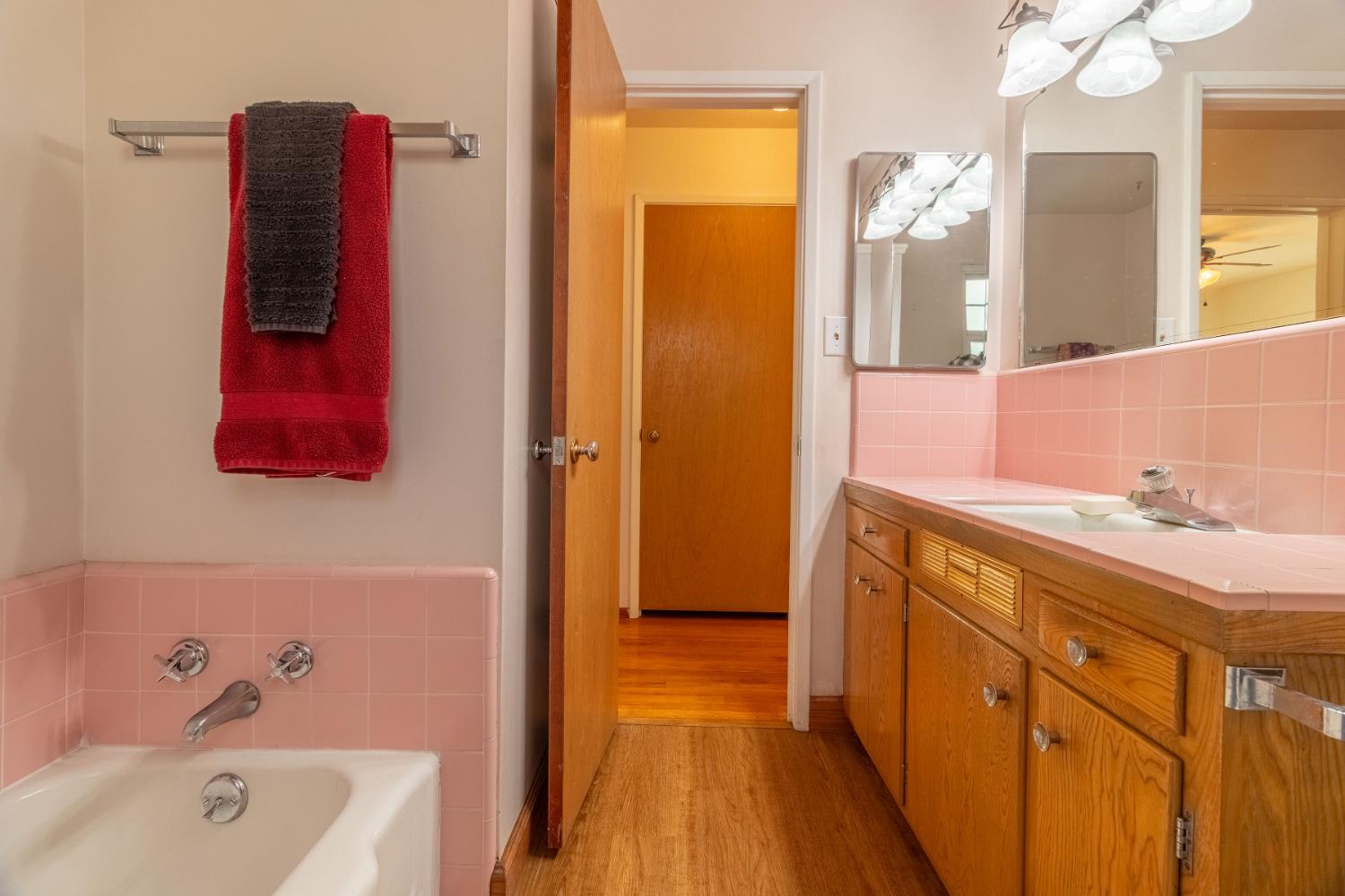 822 South California Street Lodi, CA 95240 - Photo 25 of 34 a bathroom with a tub sink and mirror