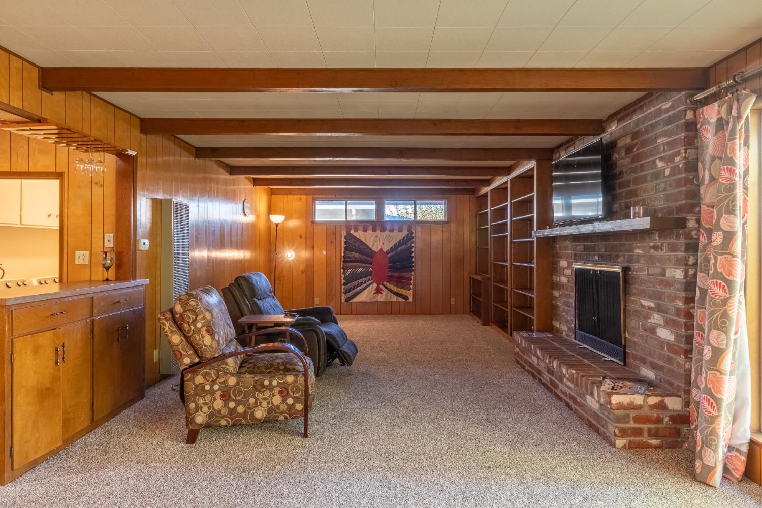 822 South California Street Lodi, CA 95240 - Photo 27 of 34 a living room with furniture a window and a fireplace