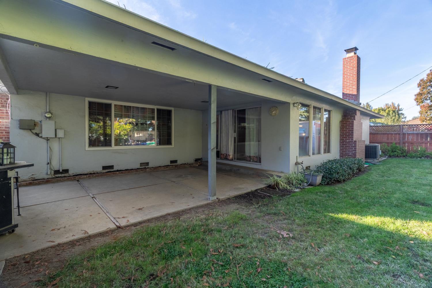 822 South California Street Lodi, CA 95240 - Photo 30 of 34 a view of a house with a backyard and porch
