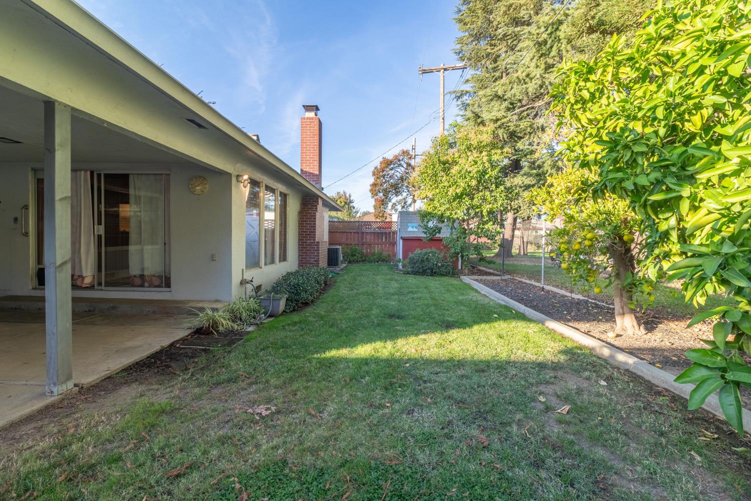 822 South California Street Lodi, CA 95240 - Photo 33 of 34 a view of a house with a yard