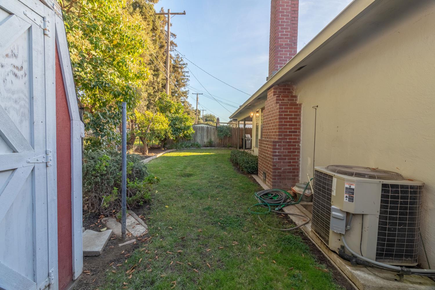 822 South California Street Lodi, CA 95240 - Photo 34 of 34 a view of a backyard with plants and a bench