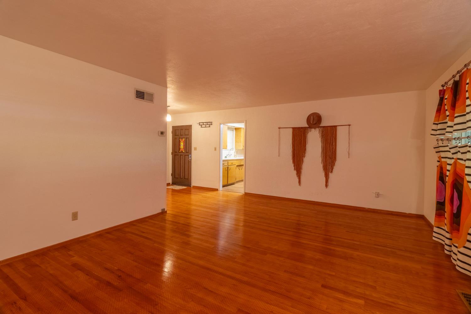 822 South California Street Lodi, CA 95240 - Photo 8 of 34 a view of a livingroom with wooden floor