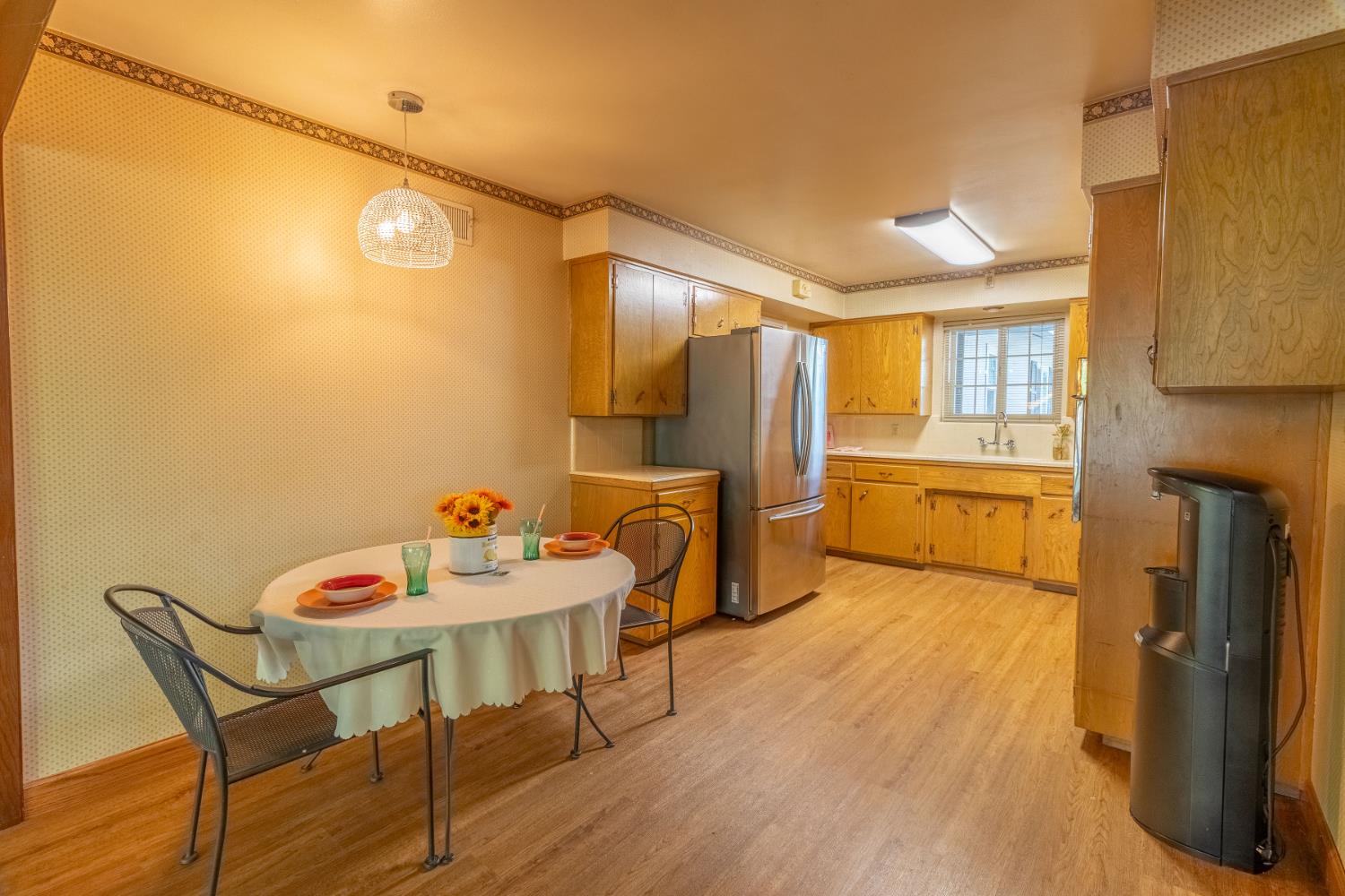 822 South California Street Lodi, CA 95240 - Photo 9 of 34 a view of a kitchen with furniture and a refrigerator