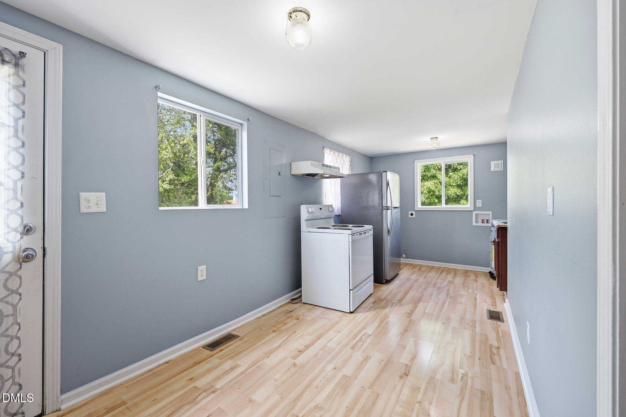 1758 Barber Mill Road Clayton, NC 27520 - Photo 8 of 41 a view of a kitchen with wooden floor windows and cabinet
