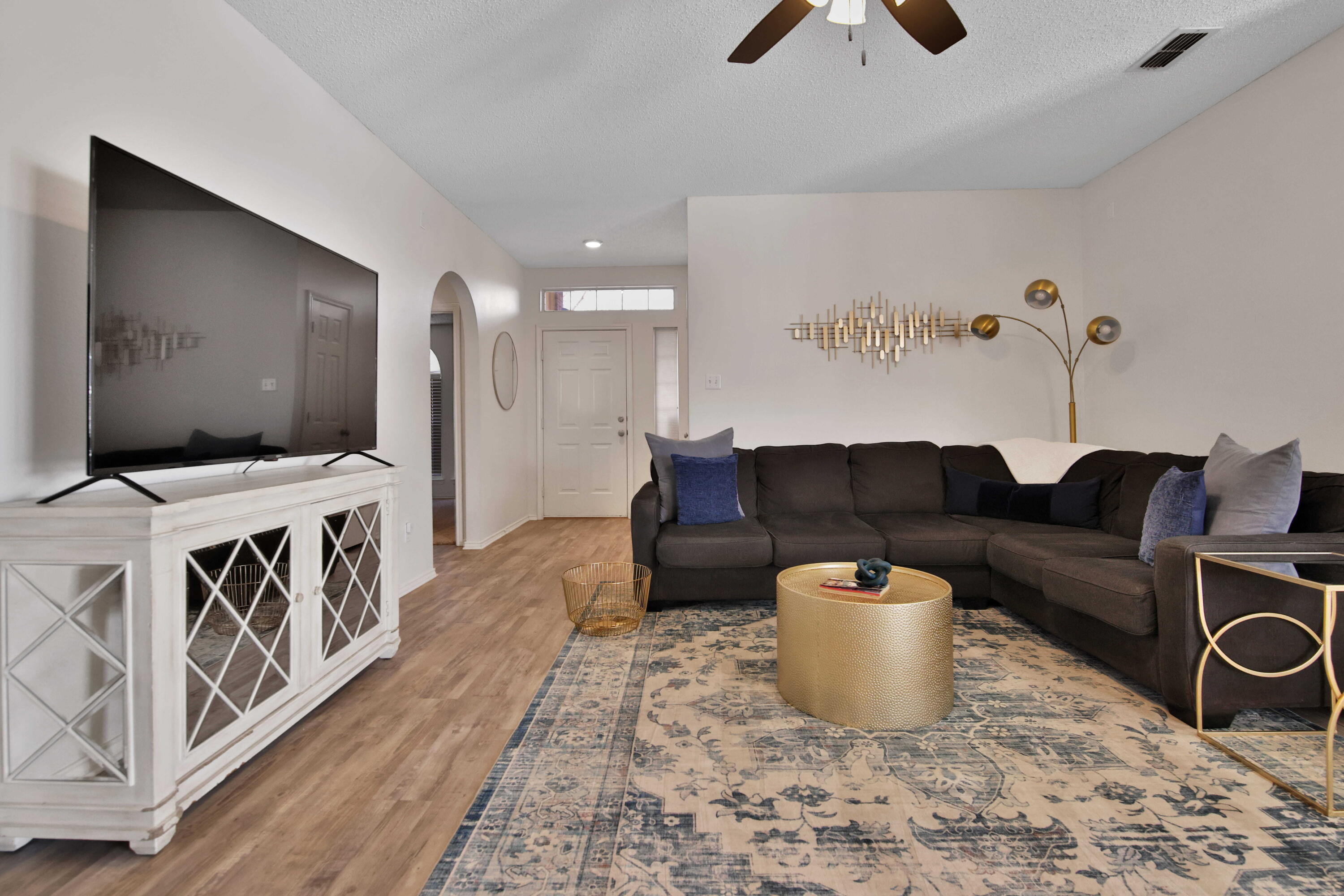 2907 90th Street Lubbock, TX 79423 - Photo 20 of 30 a living room with furniture and a flat screen tv