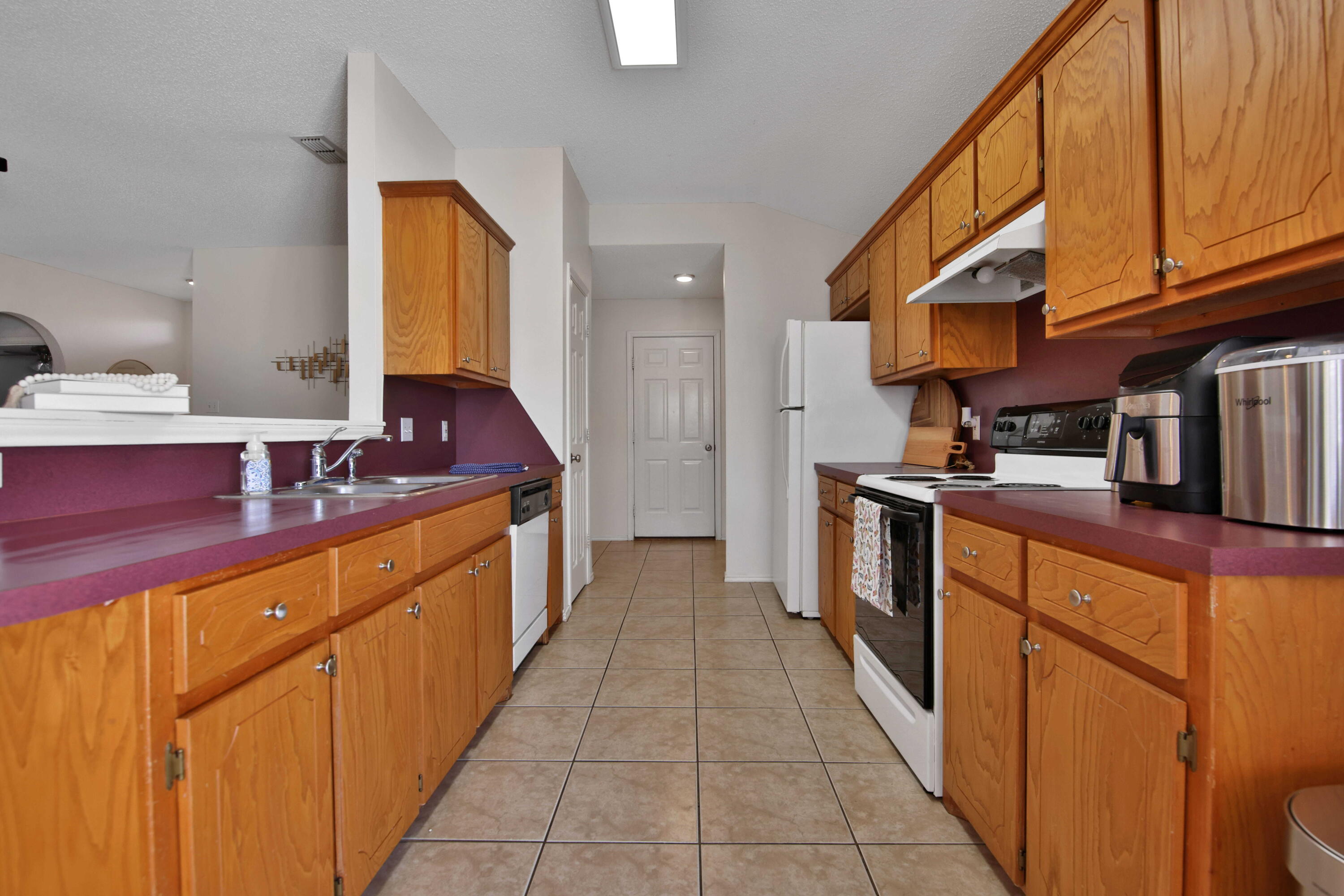 2907 90th Street Lubbock, TX 79423 - Photo 25 of 30 a kitchen with stainless steel appliances granite countertop a sink and cabinets