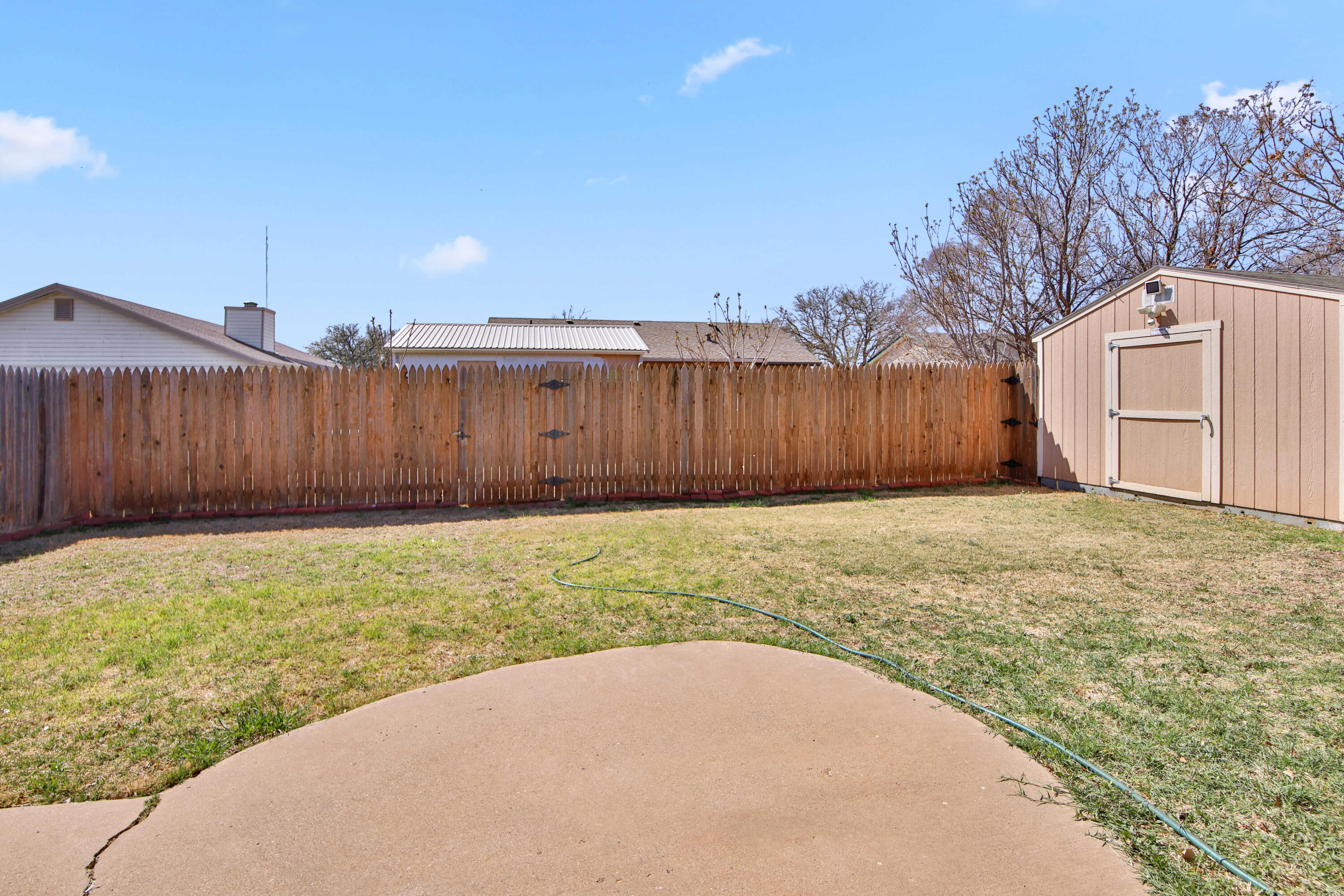 2907 90th Street Lubbock, TX 79423 - Photo 28 of 30 a view of backyard with tub and wooden fence