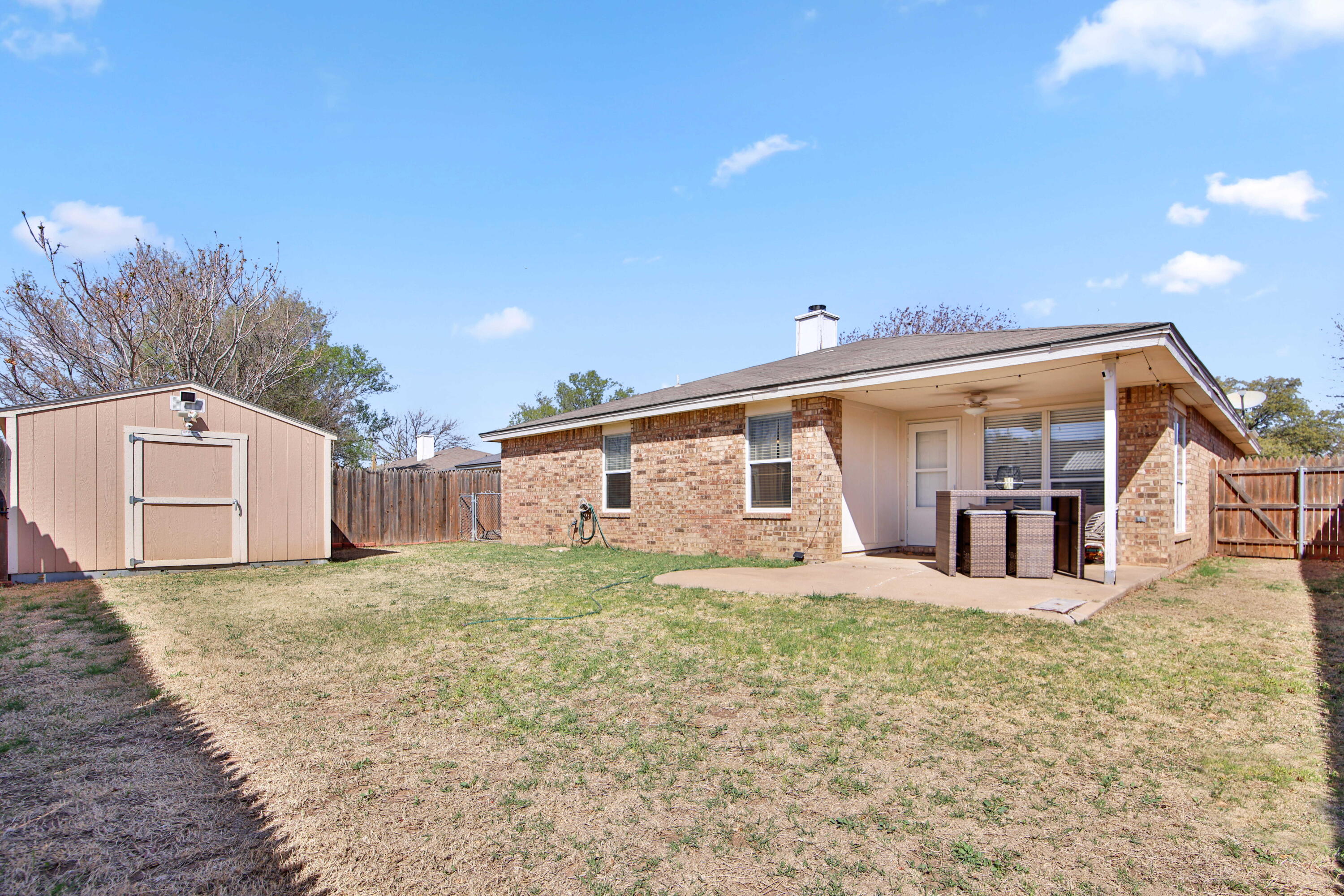 2907 90th Street Lubbock, TX 79423 - Photo 29 of 30 a view of a house with a yard and large tree