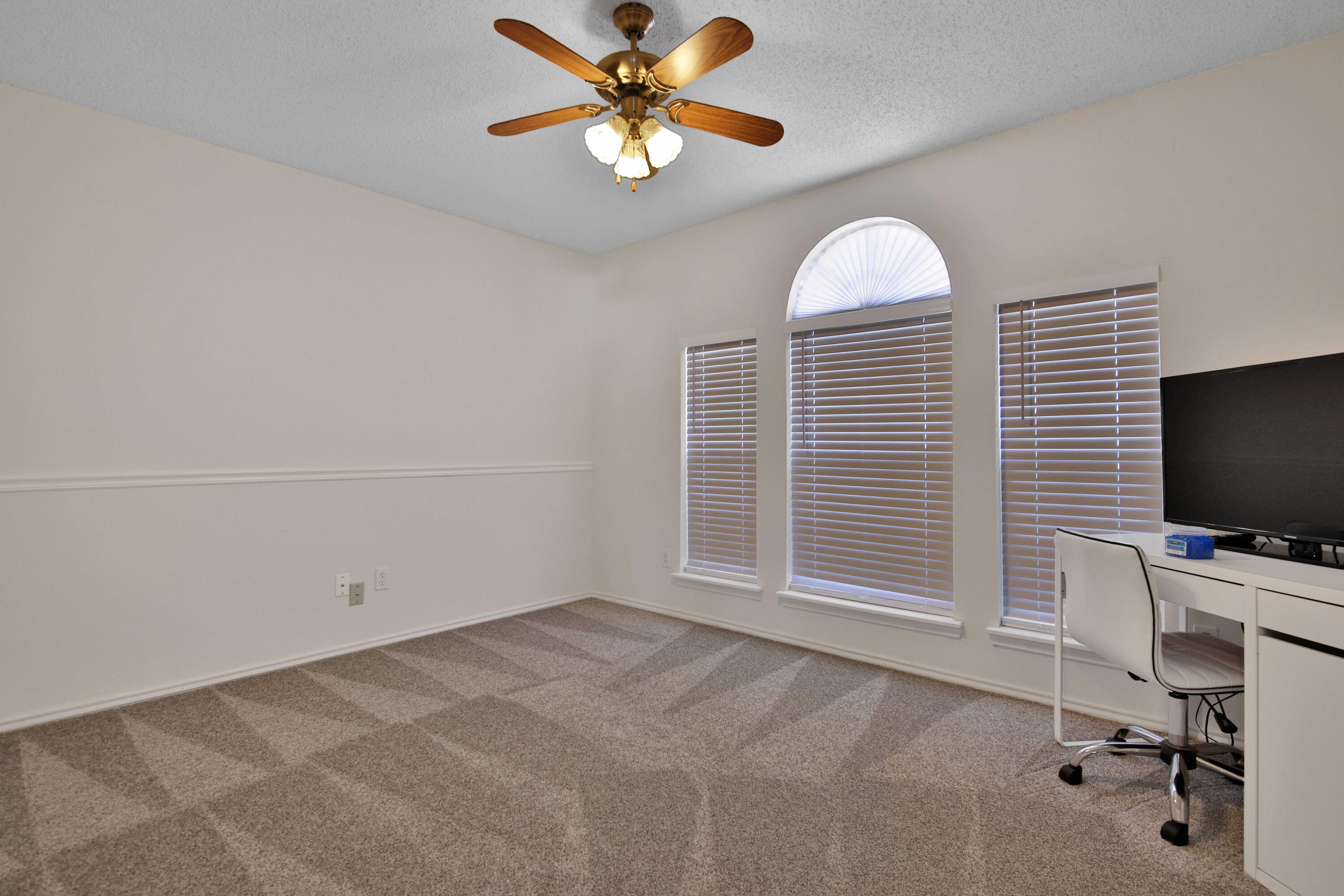 2907 90th Street Lubbock, TX 79423 - Photo 6 of 30 a view of a livingroom with a workspace