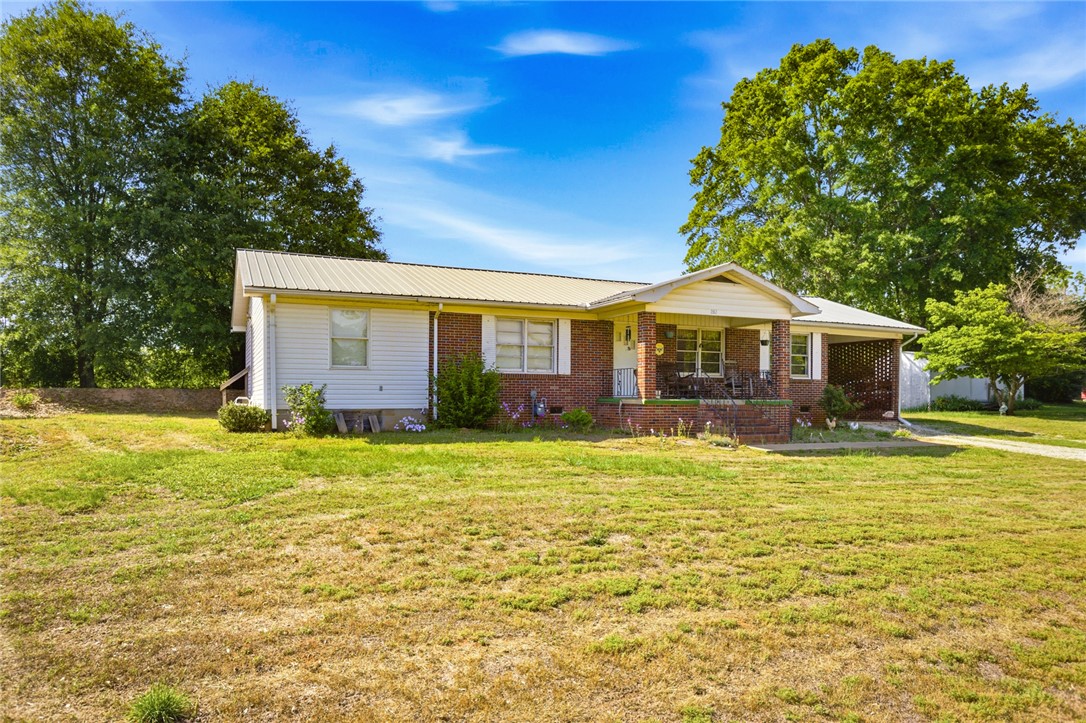 282 West Bennett Road Westminster, SC 29693 - Photo 34 of 42 This charming home offers a comfortable porch and lush, expansive yard.