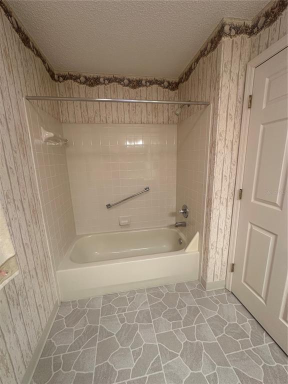 9258 Southwest 91st Circle Ocala, FL 34481 - Photo 11 of 25 a bathroom with a bathtub and a shower