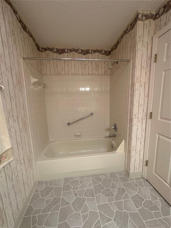 9258 Southwest 91st Circle Ocala, FL 34481 - Photo 12 of 25 a bathroom with a bathtub and a shower