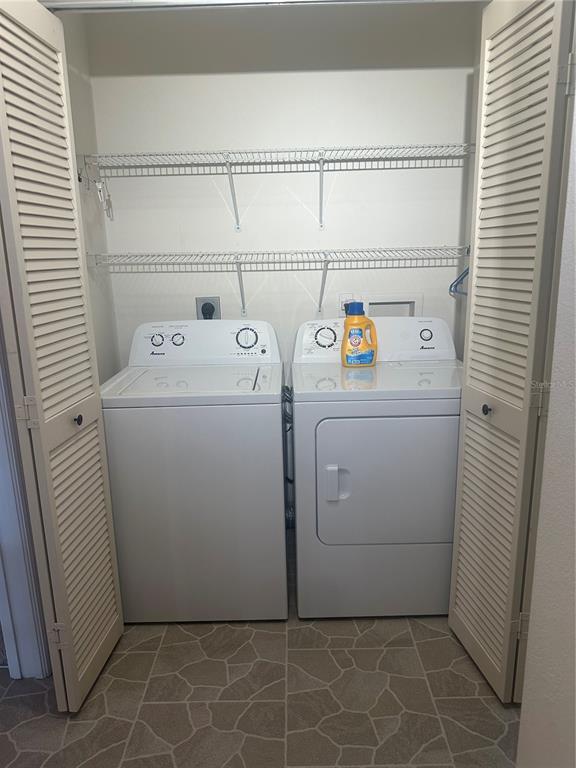 9258 Southwest 91st Circle Ocala, FL 34481 - Photo 15 of 25 a utility room with dryer and washer
