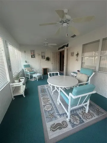 a living room with dining table and a couch