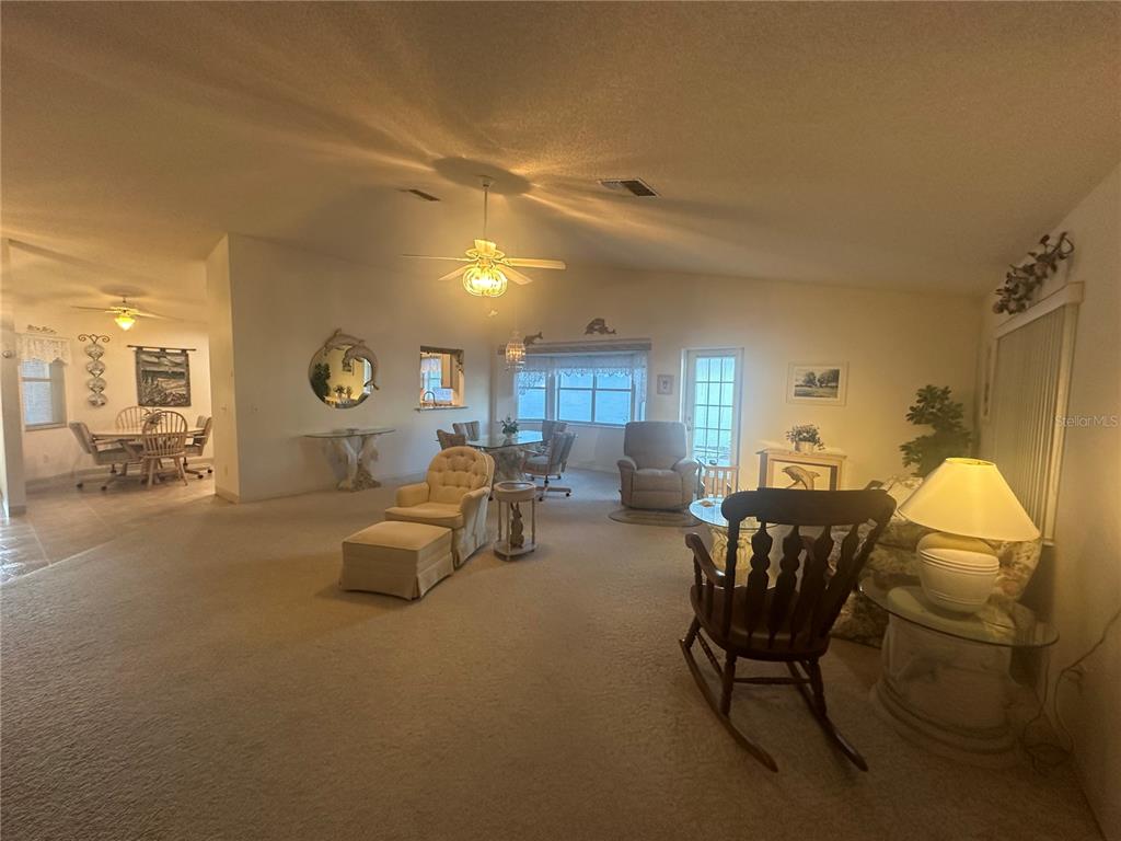 9258 Southwest 91st Circle Ocala, FL 34481 - Photo 6 of 25 a living room with furniture and a table