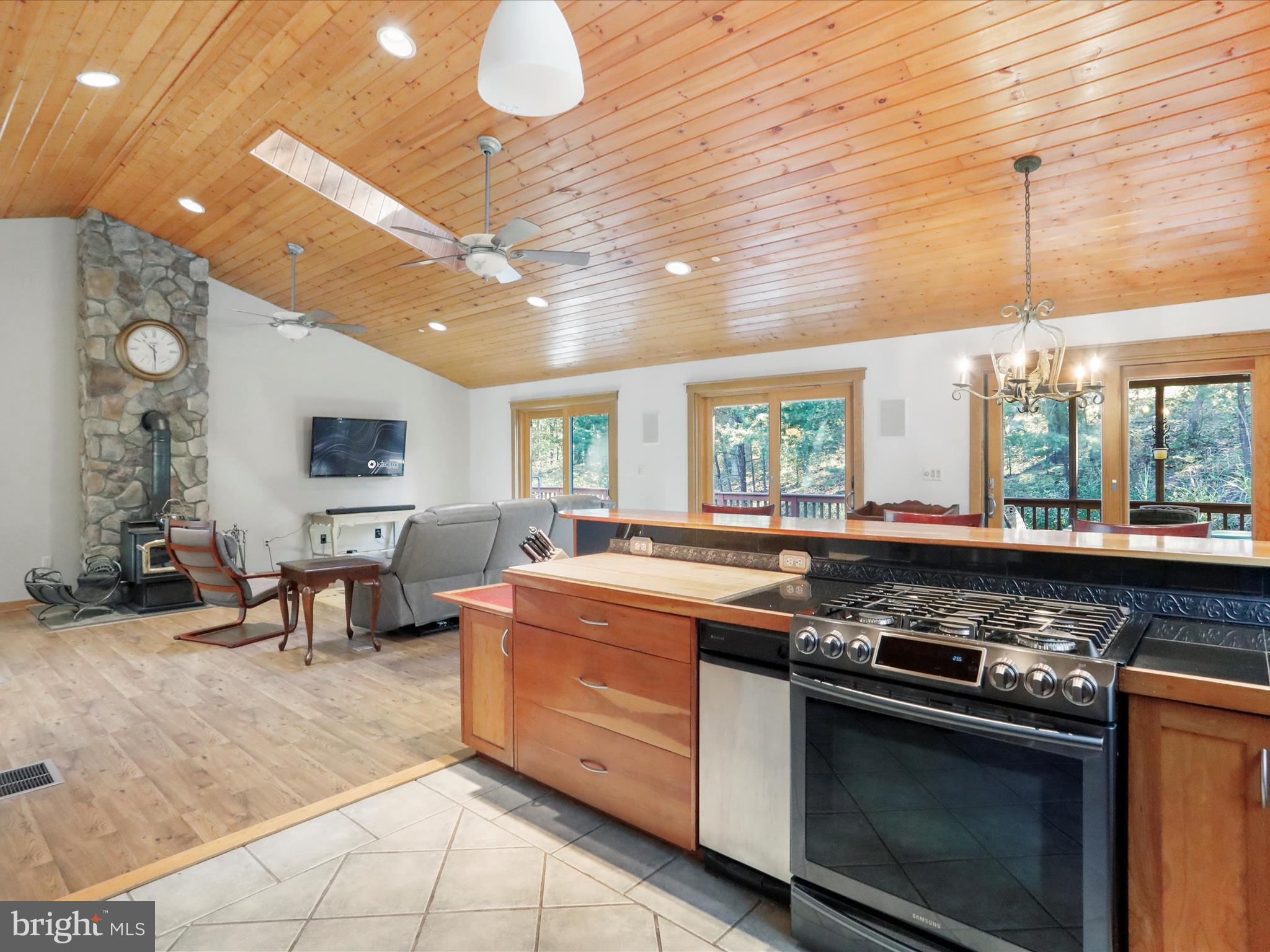 1580 Gaither Road Great Cacapon, WV 25422 - Photo 15 of 65 a kitchen with stainless steel appliances granite countertop a stove and a sink
