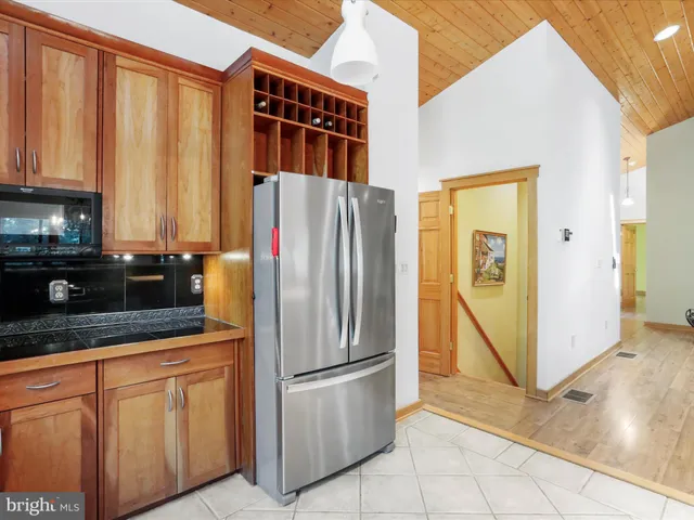 an empty room with wooden floor and closet