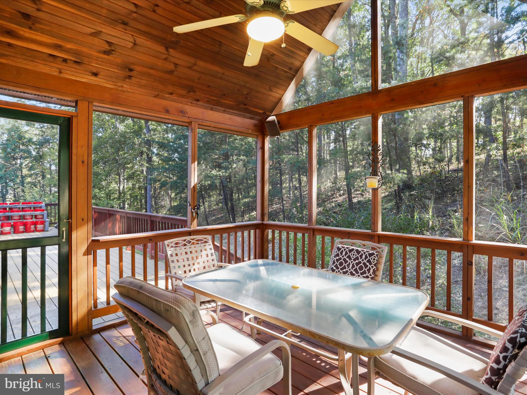 1580 Gaither Road Great Cacapon, WV 25422 - Photo 21 of 65 a view of balcony with wooden floor and outdoor seating