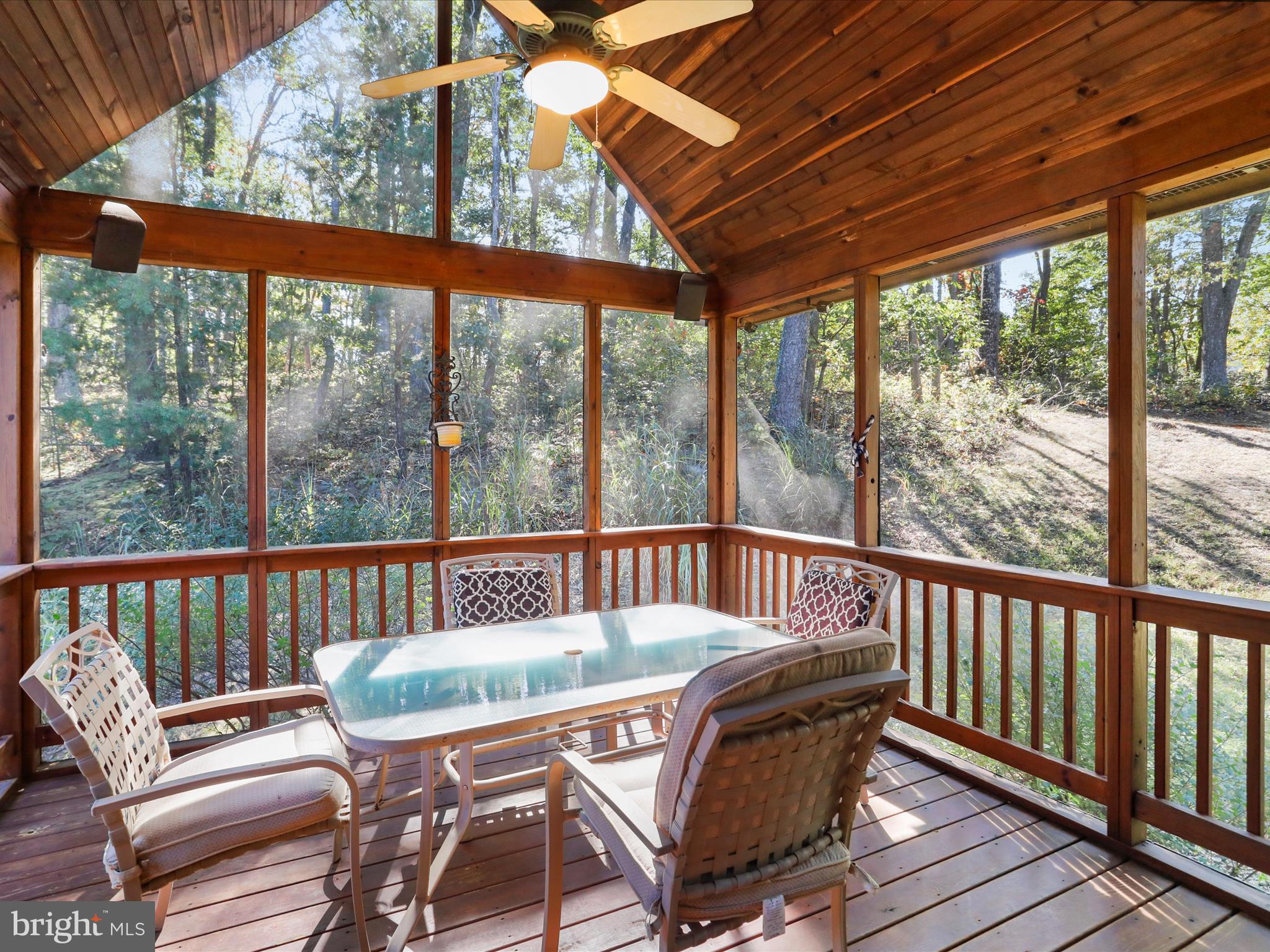 1580 Gaither Road Great Cacapon, WV 25422 - Photo 22 of 65 a view of a chair in wooden deck