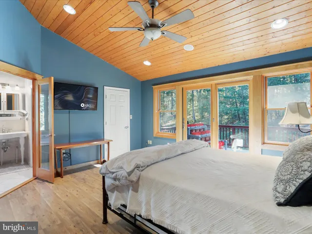 a bedroom with a bed and a lamp