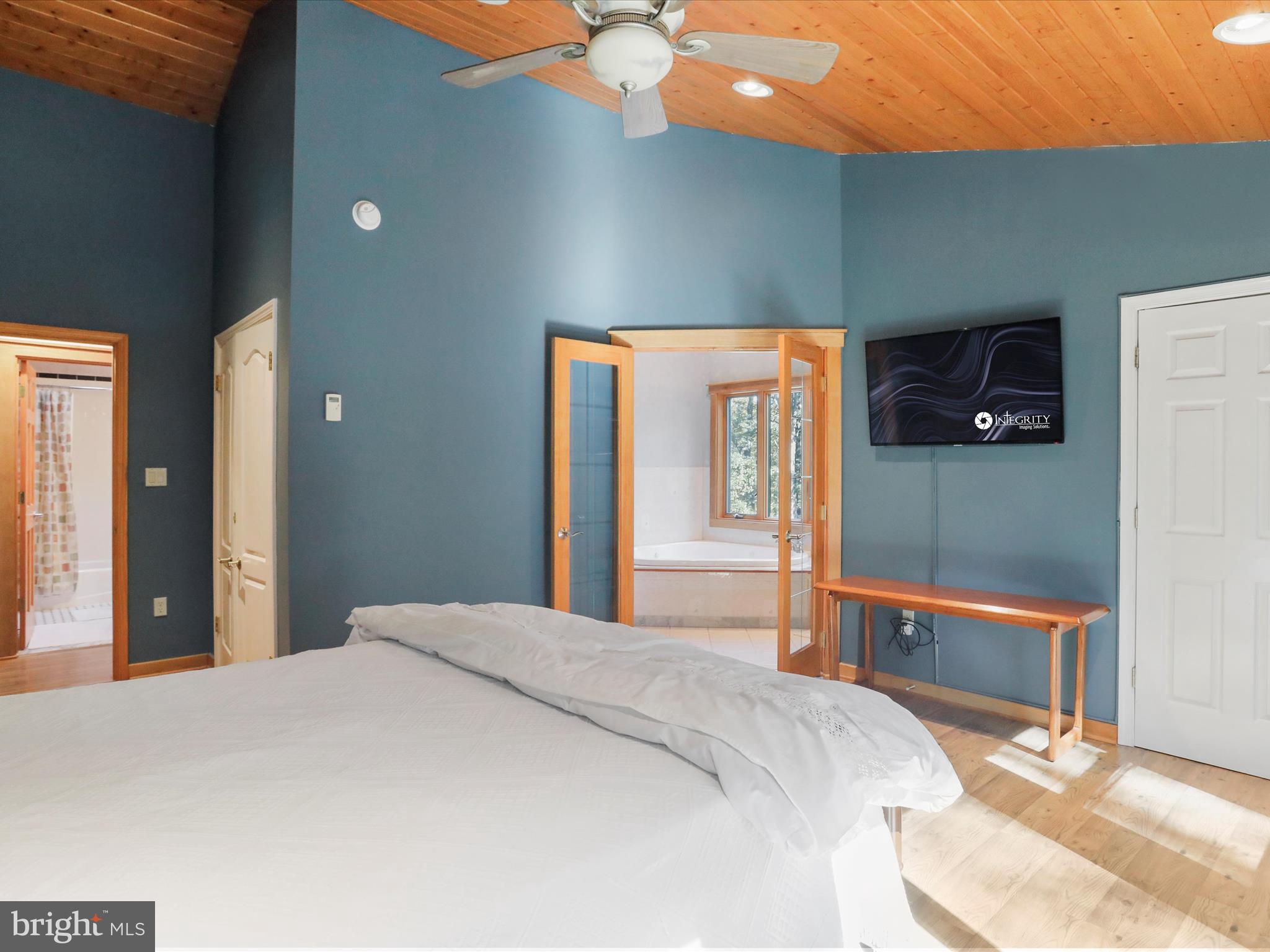 1580 Gaither Road Great Cacapon, WV 25422 - Photo 25 of 65 a bedroom with a bed and a lamp