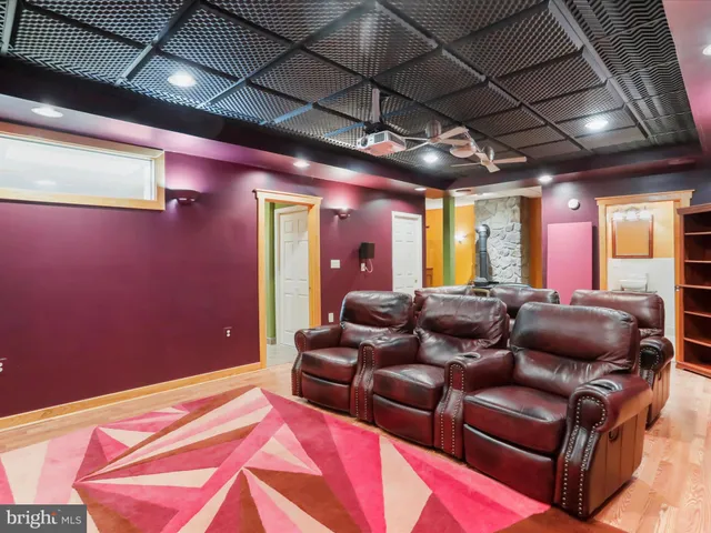 a balcony with wooden floor and trees in the back