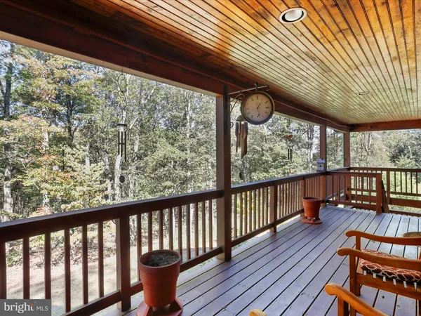 a view of a porch with wooden floor