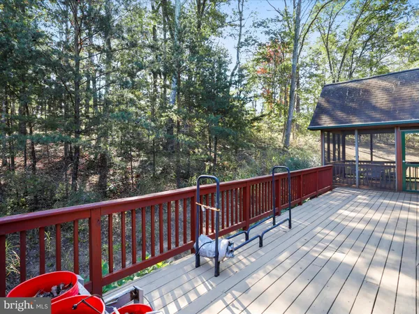 an aerial view of house with yard and mountain view in back