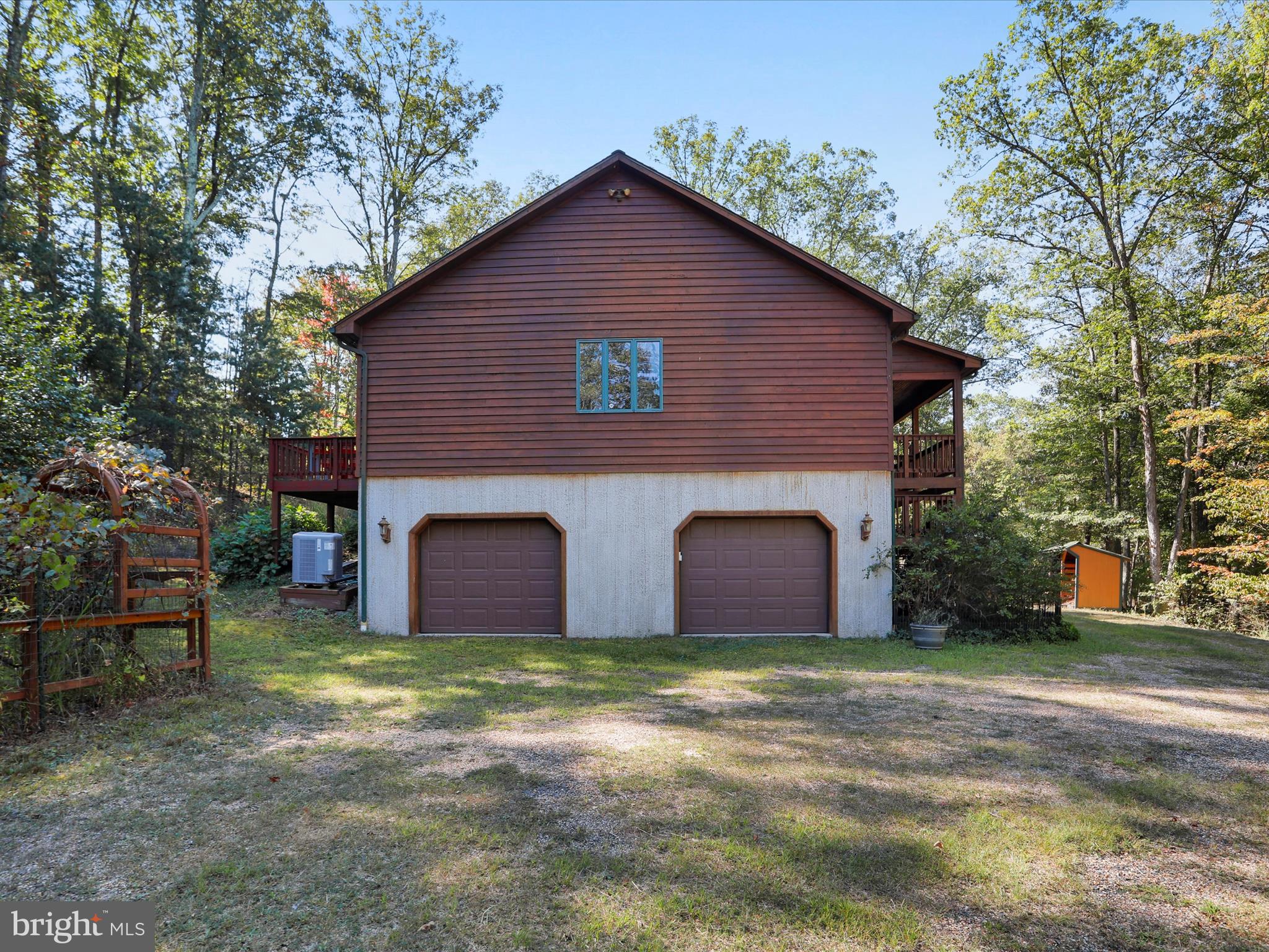 1580 Gaither Road Great Cacapon, WV 25422 - Photo 45 of 65 a view of a house with a yard
