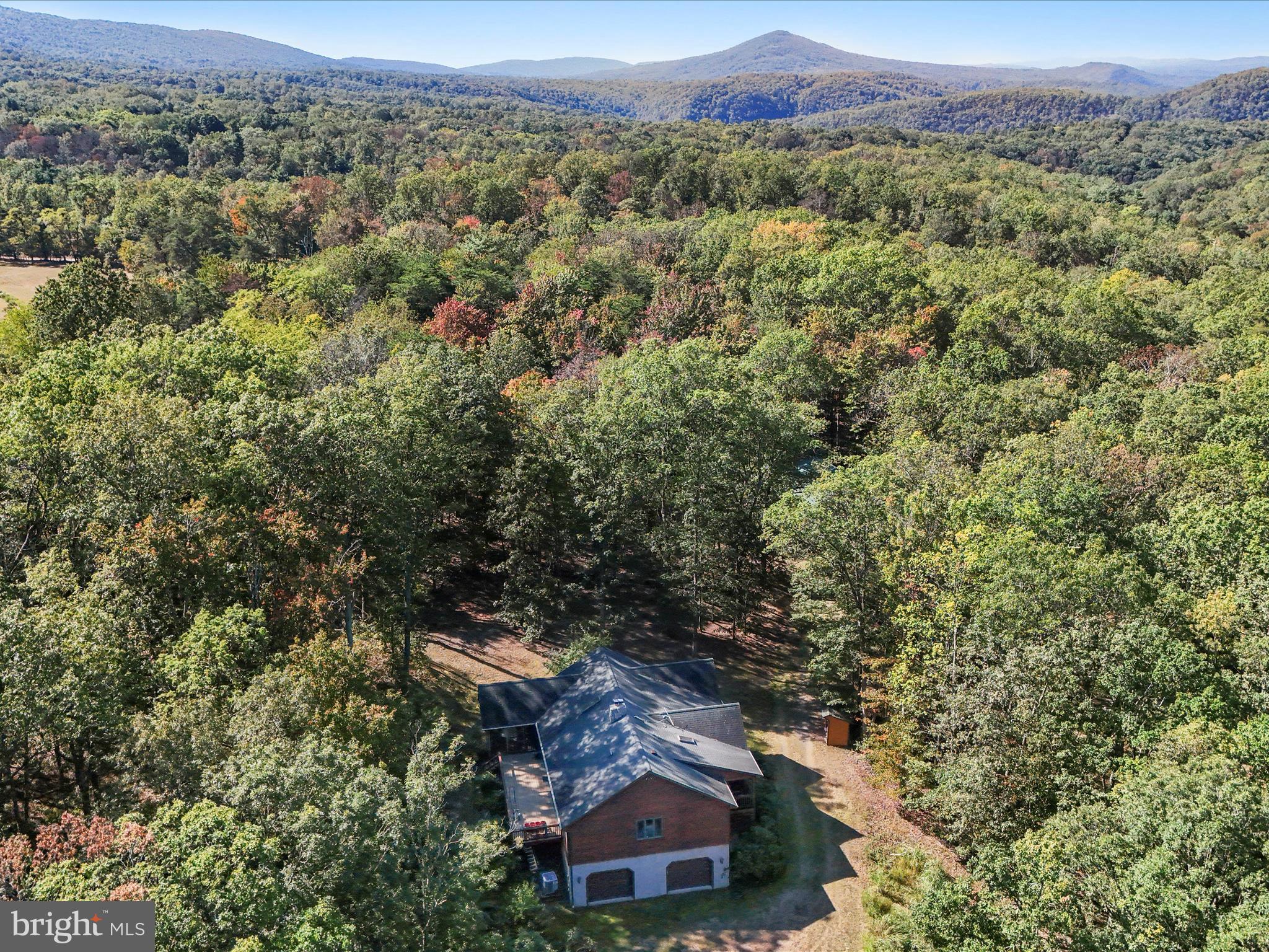 1580 Gaither Road Great Cacapon, WV 25422 - Photo 52 of 65 an aerial view of a house with a yard