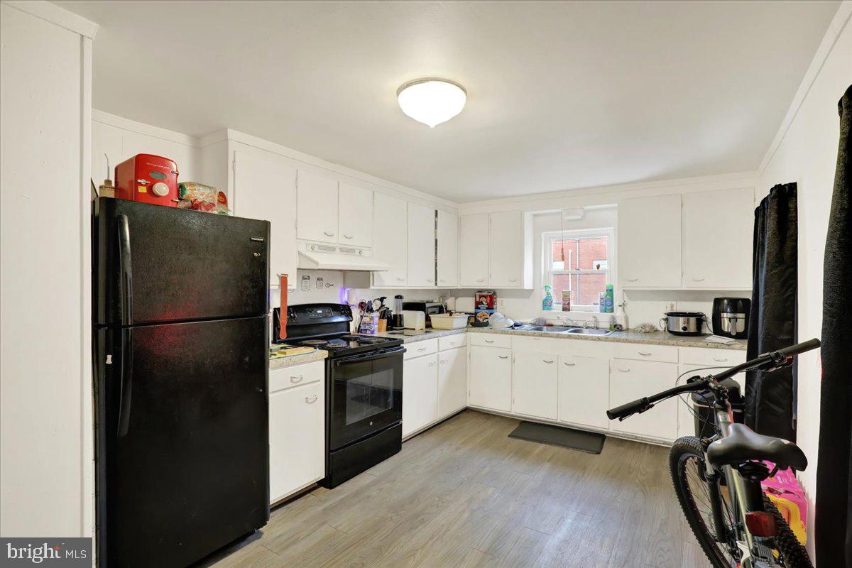 746 Maple Street Lebanon, PA 17046 - Photo 16 of 21 a kitchen with a refrigerator stove and sink