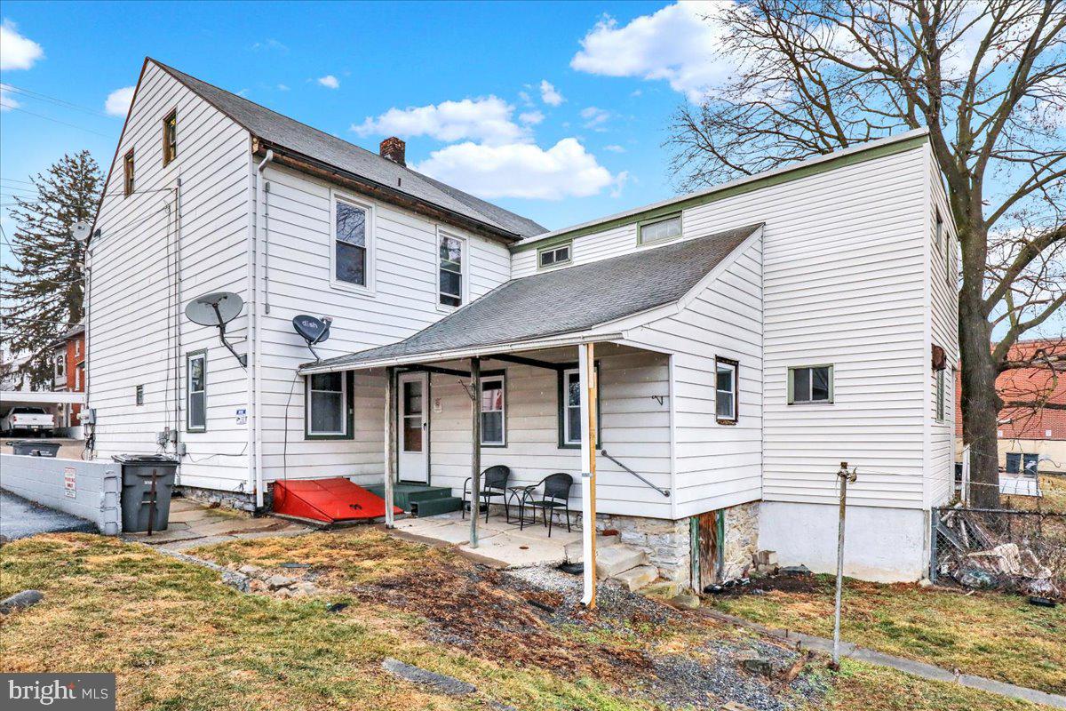746 Maple Street Lebanon, PA 17046 - Photo 19 of 21 a view of a white house with a white roof and chairs