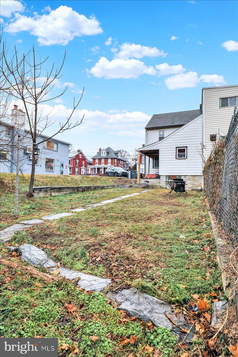 746 Maple Street Lebanon, PA 17046 - Photo 21 of 21 a view of swimming pool with lawn chairs and large trees
