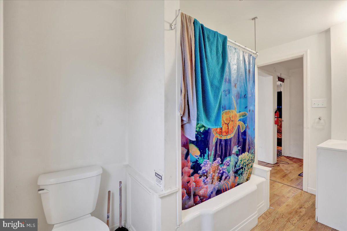 746 Maple Street Lebanon, PA 17046 - Photo 9 of 21 a bathroom with a toilet and shower curtain