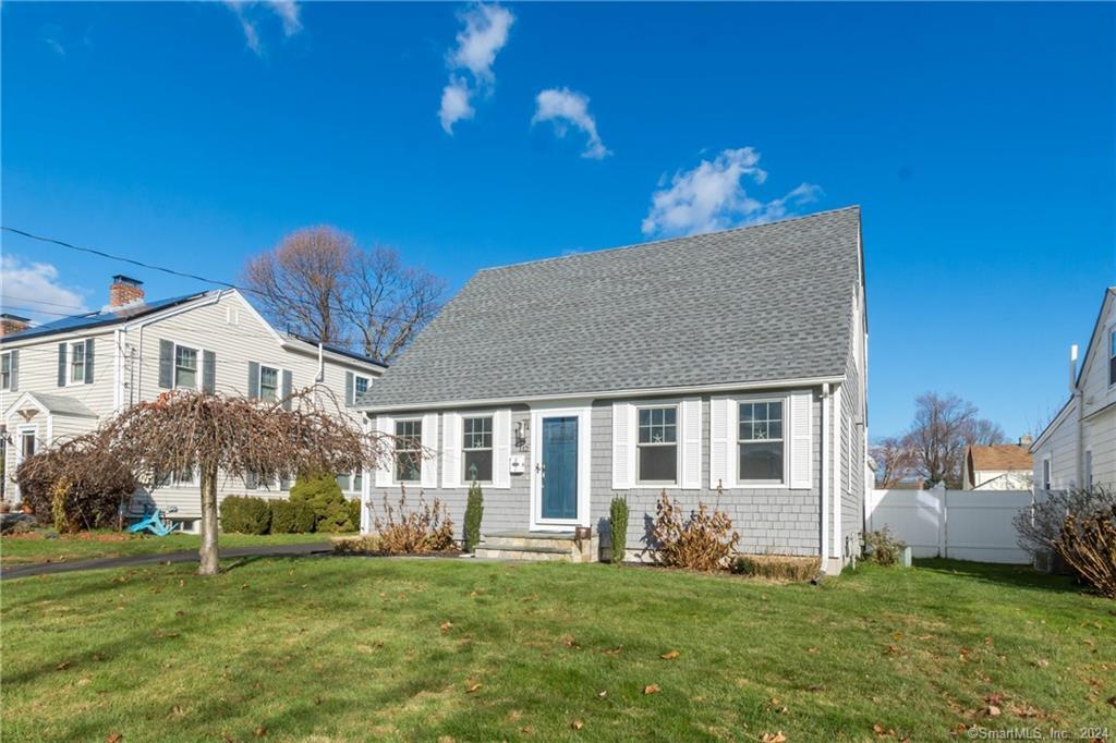 112 Lordship Road Stratford, CT 06615 - Photo 1 of 1 a front view of a house with a garden