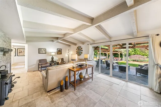 a living room with lots of furniture and clutter