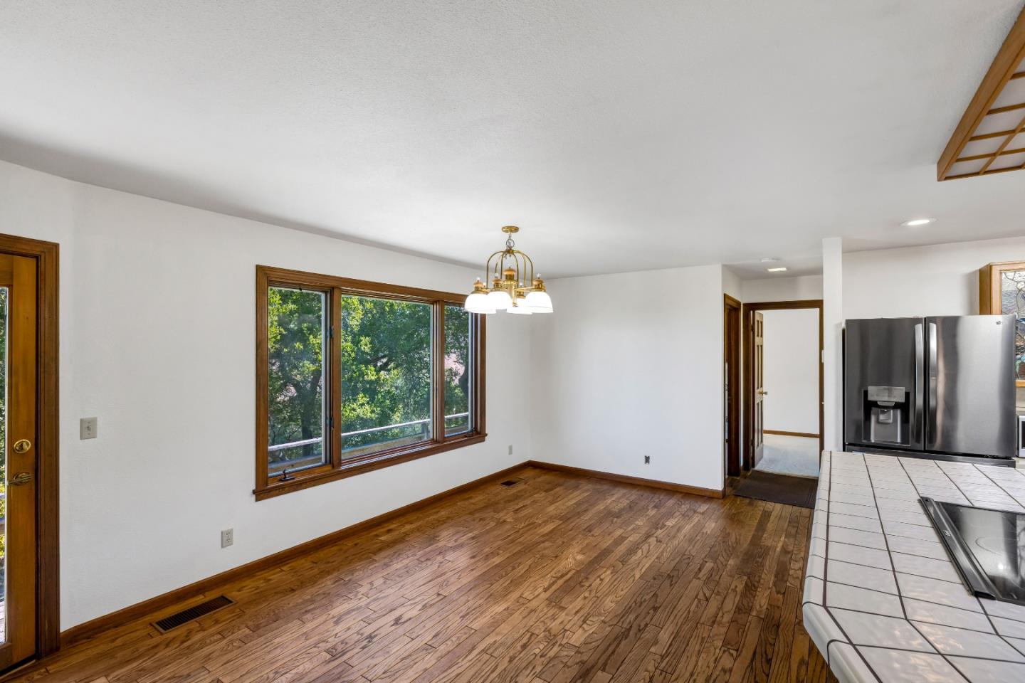 274 Corral De Tierra Road Salinas, CA 93908 - Photo 12 of 46 wooden floor in an empty room with a window